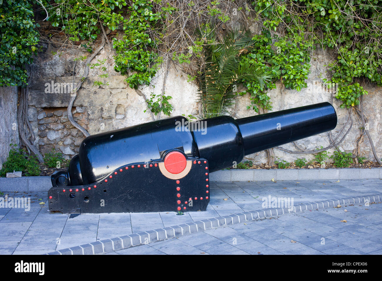 Old naval cannon on a sidewalk in Gibraltar. Stock Photo