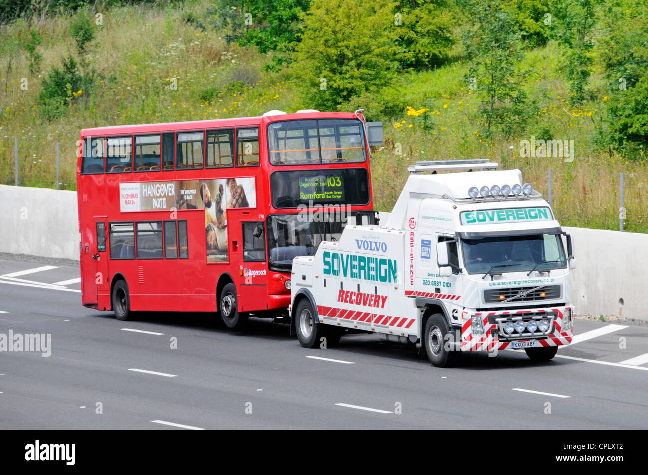 Stagecoach London double decker bus being towed by Volvo breakdown recovery truck Stock Photo
