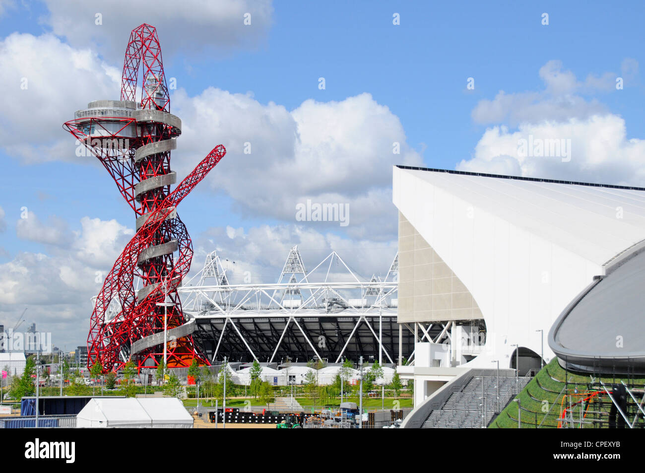 ArcelorMittal Orbit tower with part of main stadium & Aquatics Centre in The 2012 London Olympic park Stratford Newham East LondonEngland UK Stock Photo