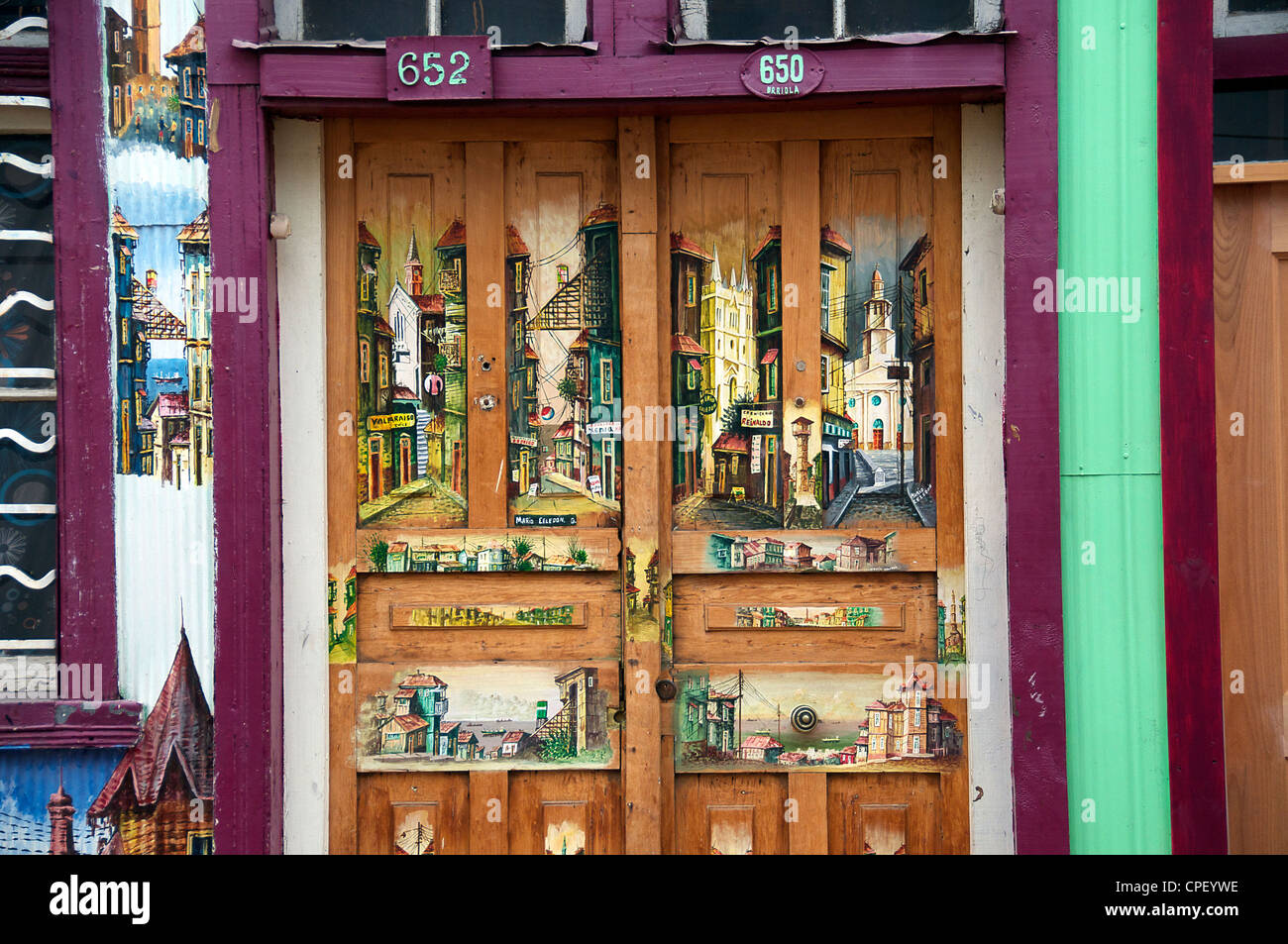 Painted scenes in front door Cerro Concepcion Valparaiso Chile Stock Photo