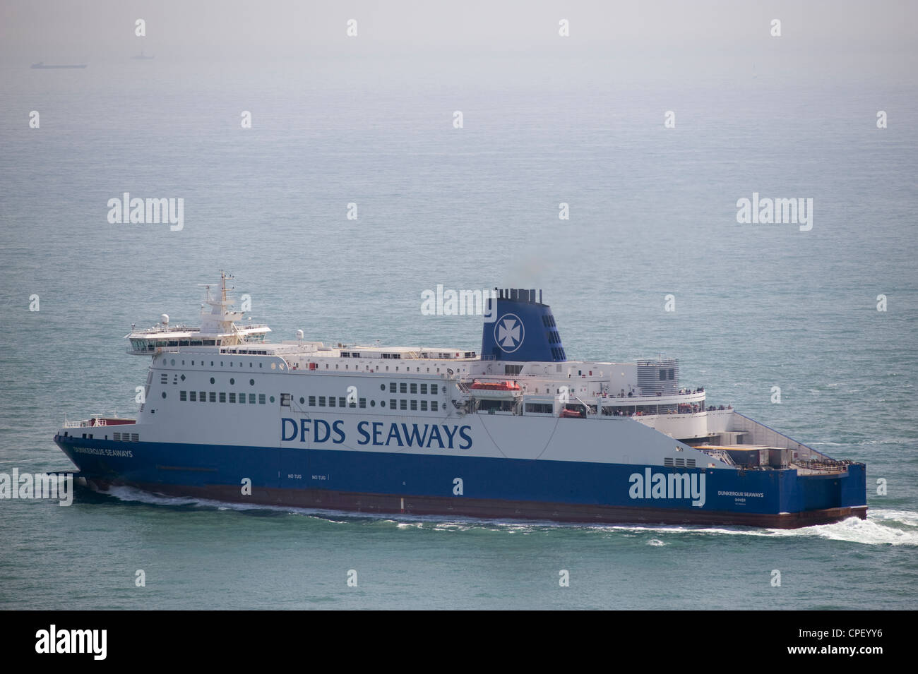 Cross channel DFDS ferry Dunkerque Seaways leaving the port of Dover in England with shipping in the English Channel Stock Photo