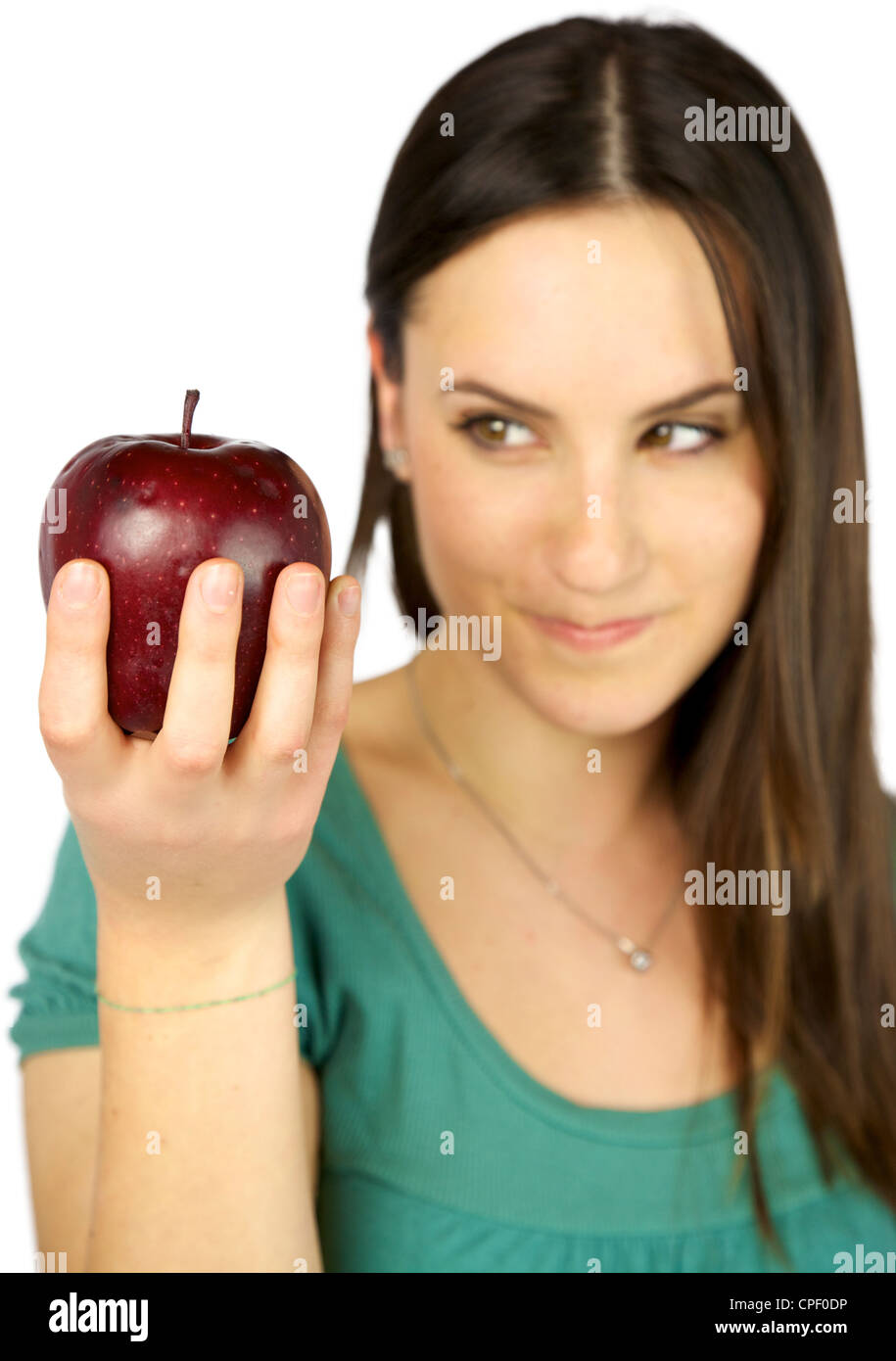 Focus on red big apple out of focus on girl hungry wanting to eat it