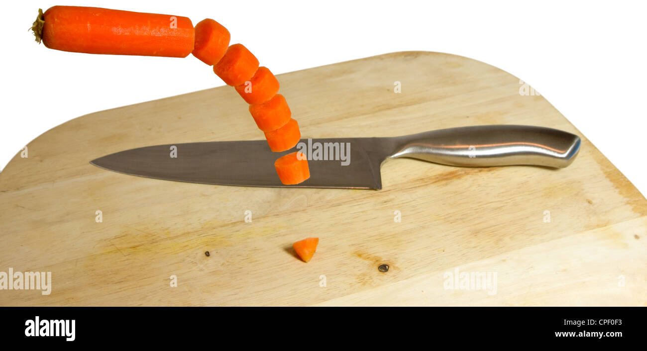 chopping a carrot Stock Photo