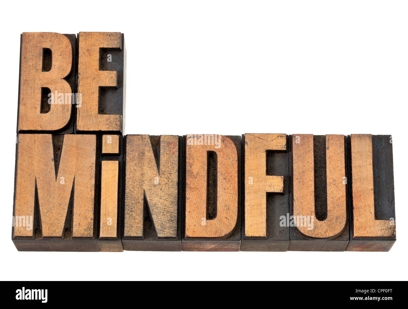 Be mindful - isolated text in vintage letterpress wood type Stock Photo