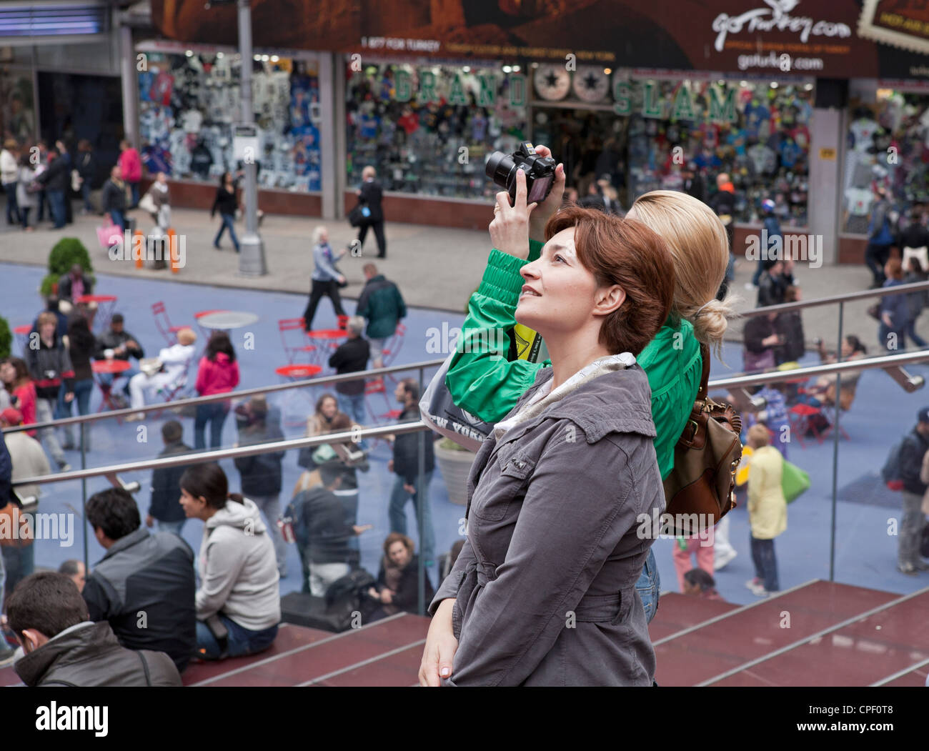2 women take in the sights in Times Square in New York City. Stock Photo