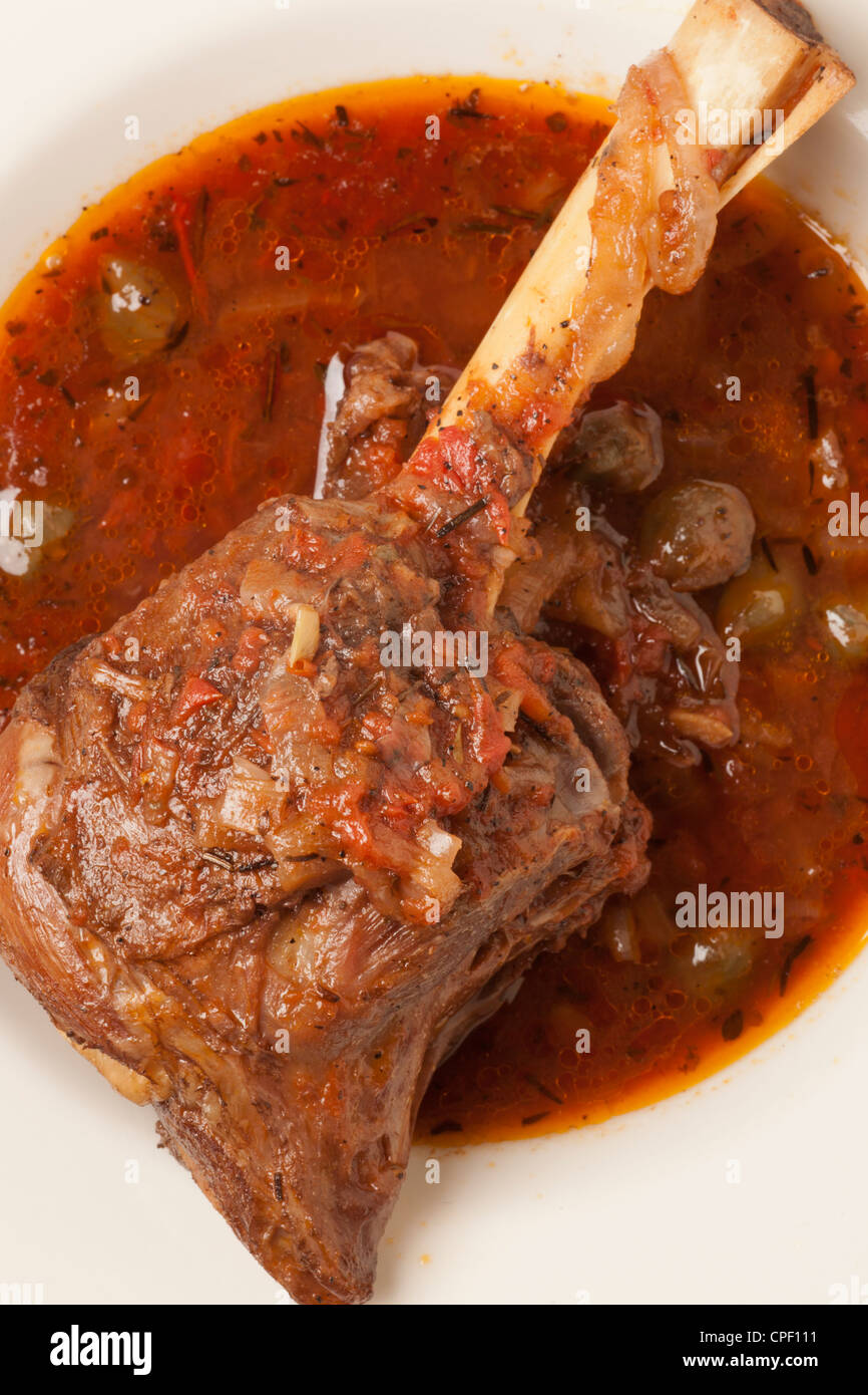 Lamb shanks braised in tomato sauce Stock Photo Alamy
