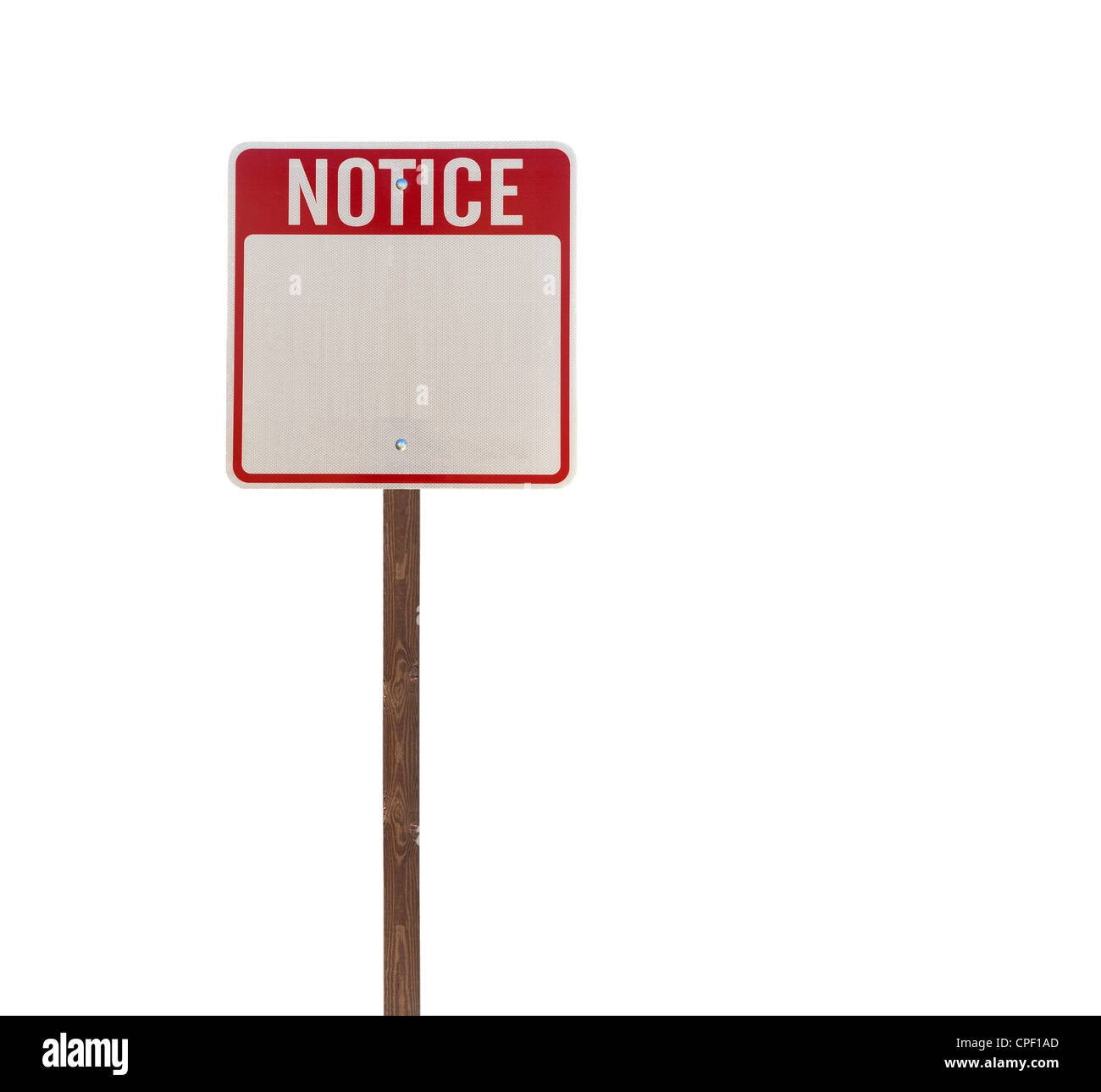 Tall isolated notice road sign on a wooden post. Stock Photo