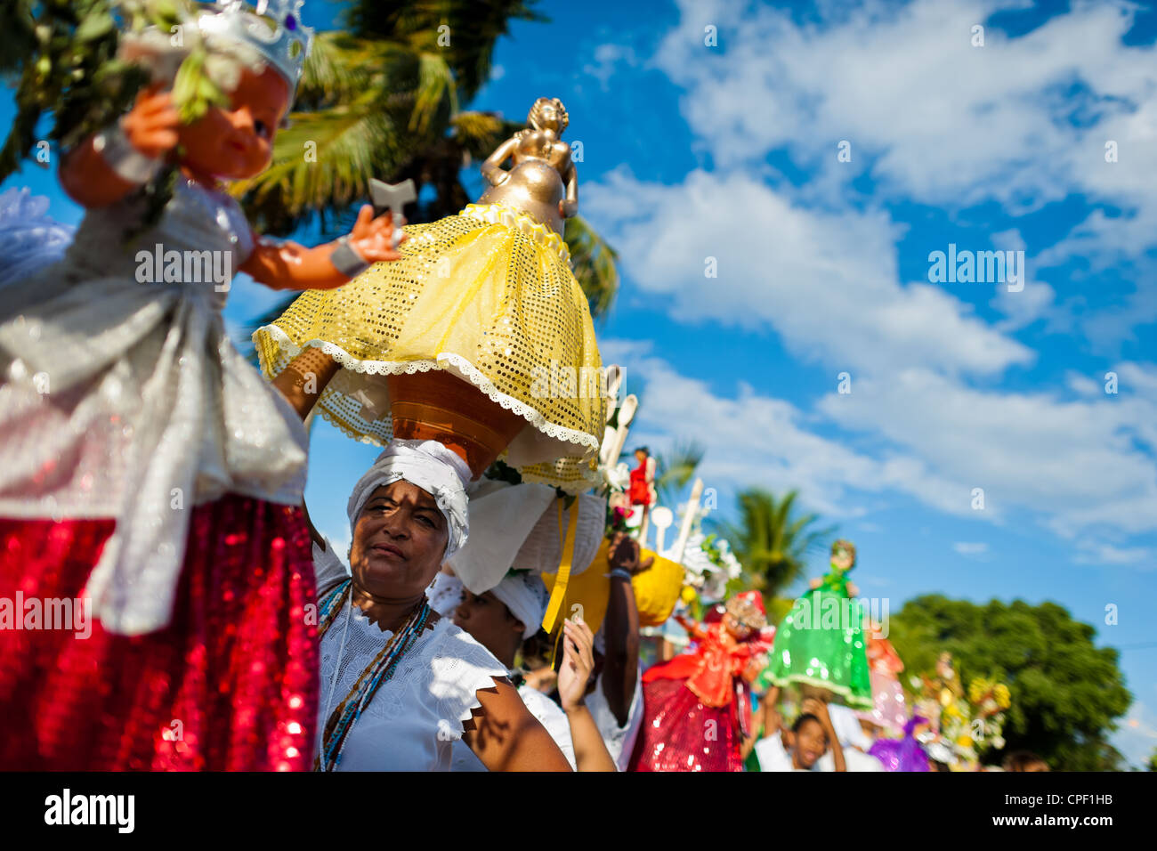 Baiana Women Carry Religious Figurines During The Ritual Procession In Baiana Women Carry Religious Figurines During The Ritual Procession In