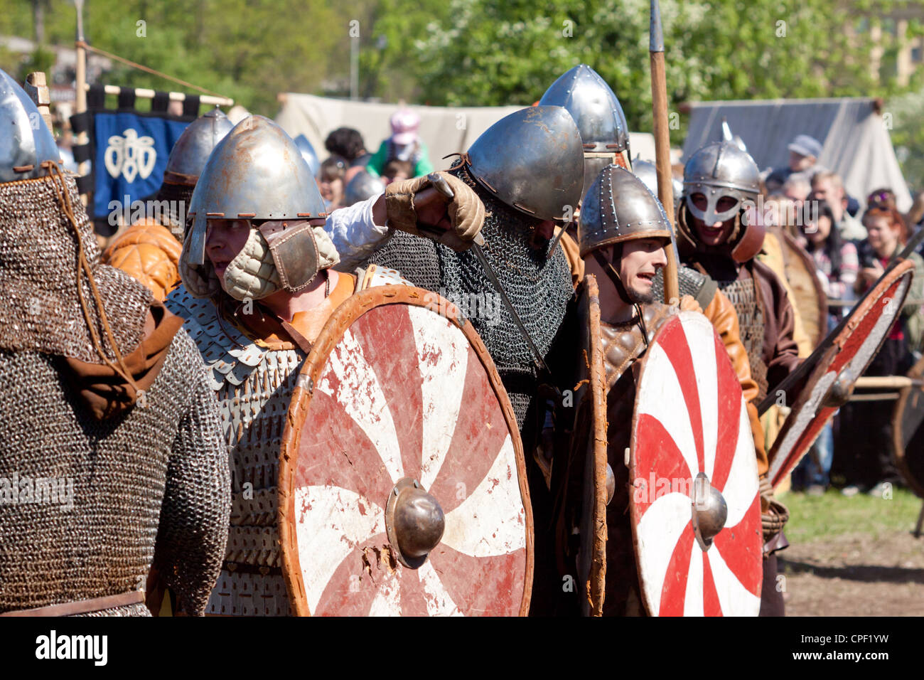 Group of warriors with shields Stock Photo - Alamy