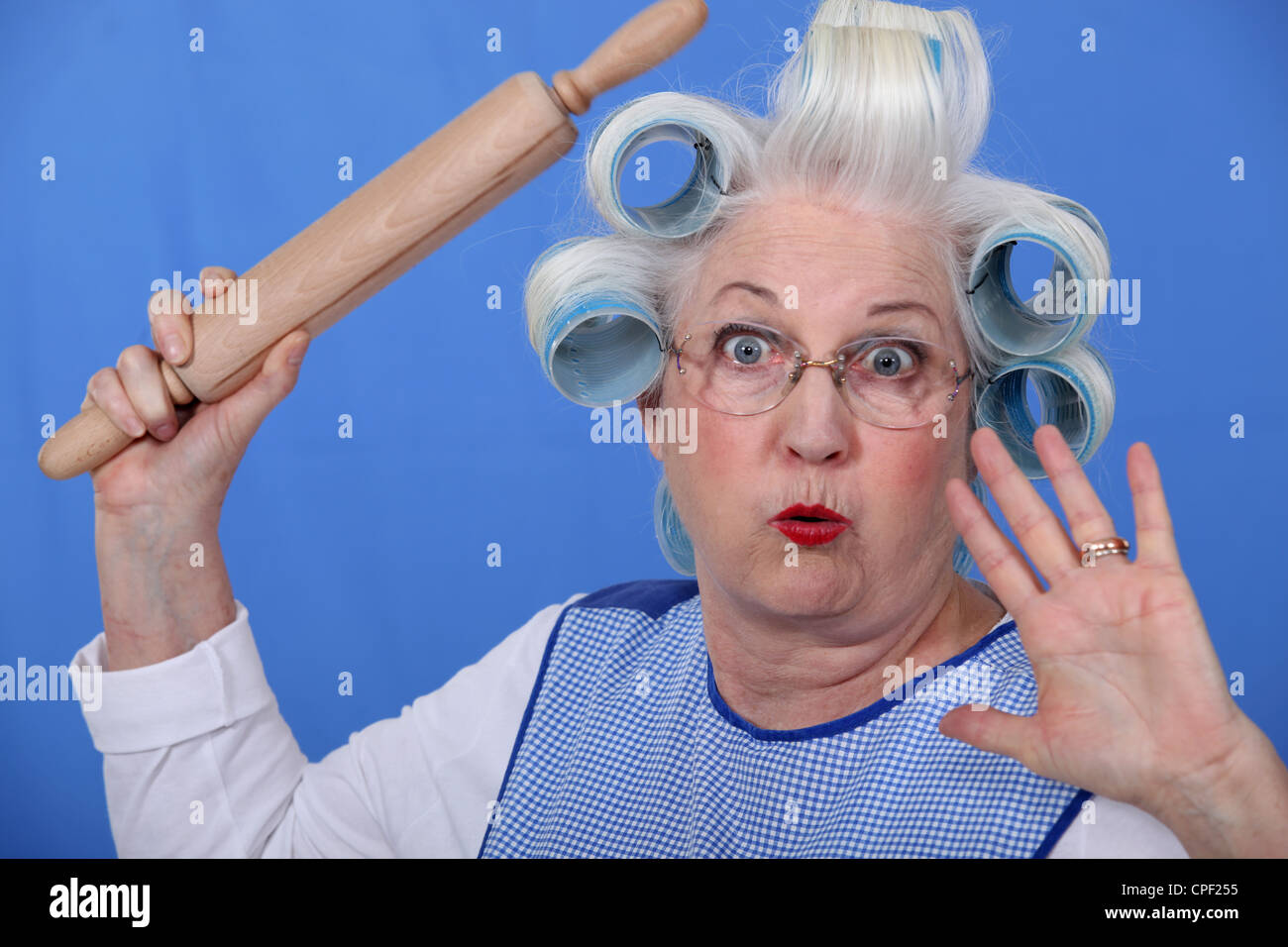 Scared old lady with hair rollers Stock Photo Alamy