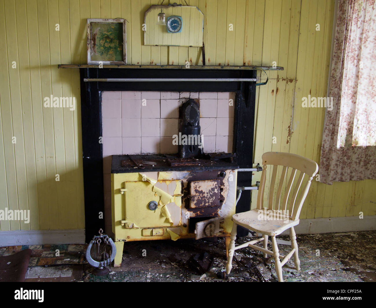 Yellow Rayburn and Chair, Isle of Harris, Scotland Stock Photo