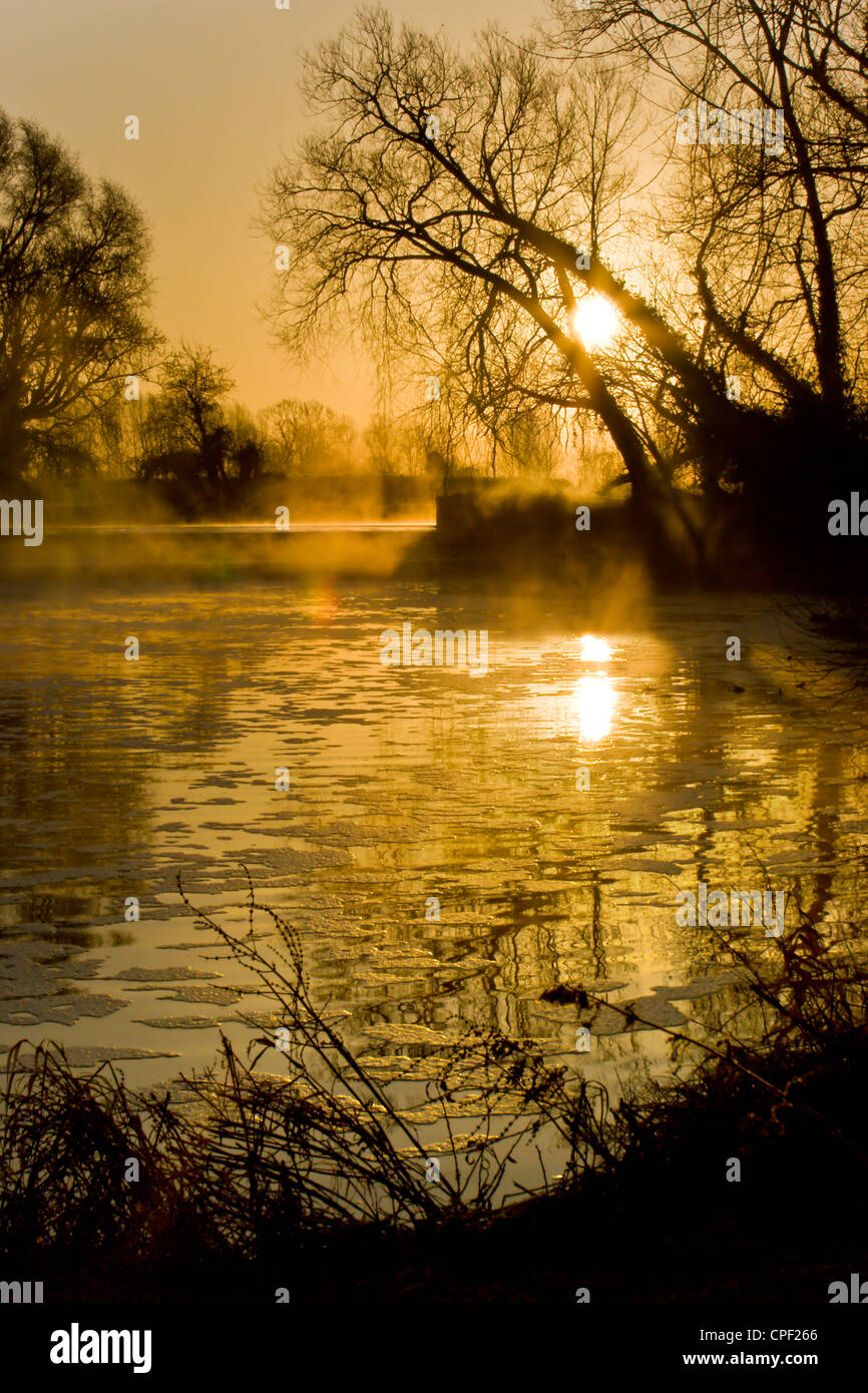 Sunrise and early morning mist at Cossington Mill, Cossington, Leicestershire Stock Photo