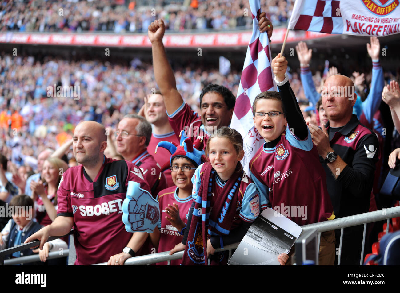 Jubilant West Ham United football fans celebrating victory at Wembley Stock Photo