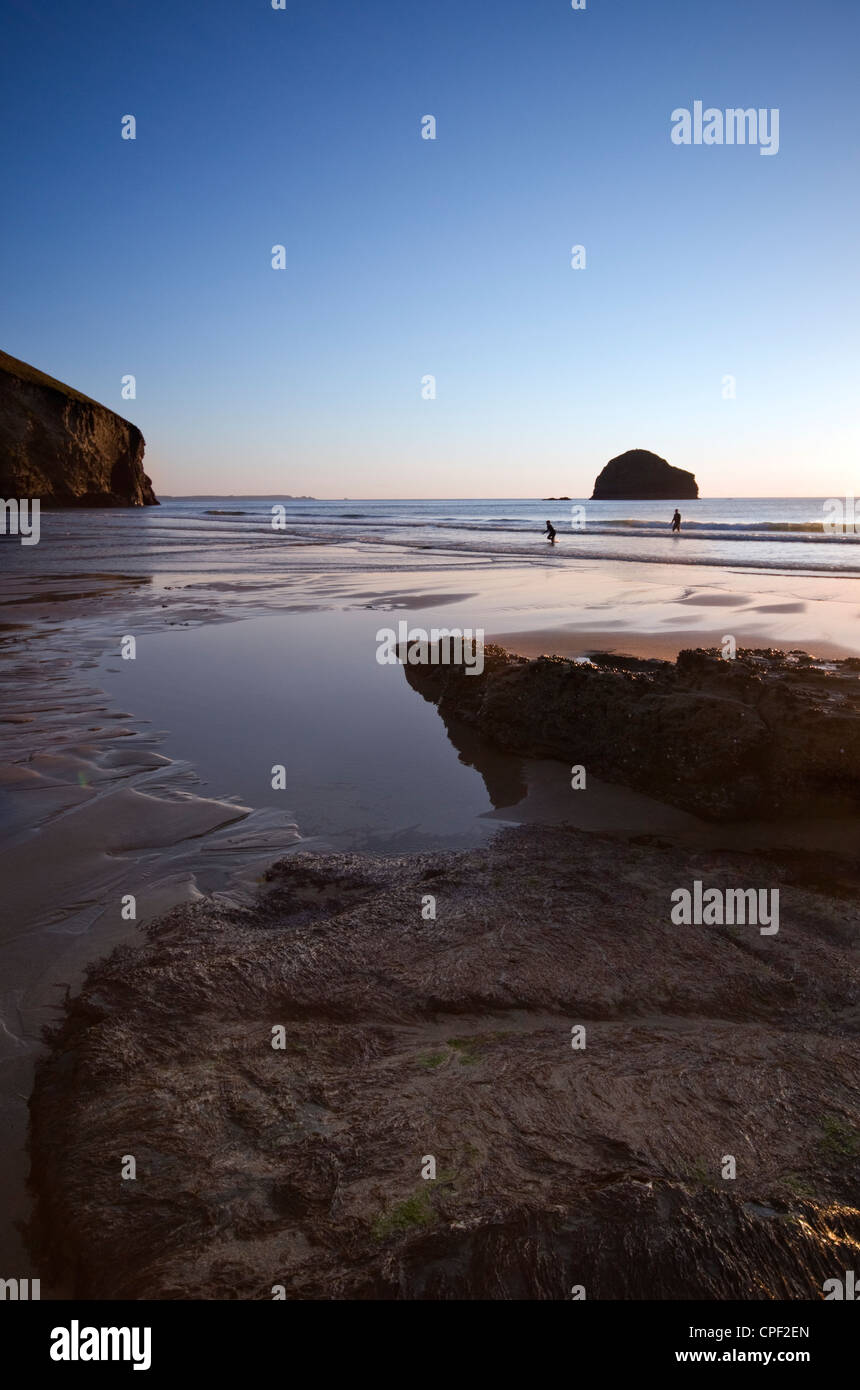 Surfers in the sea at Trebarwith Strand in Cornwall, England, UK Stock