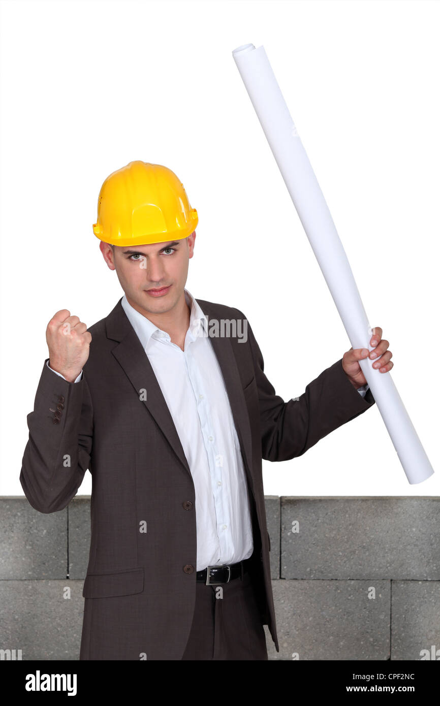 successful architect in front of wall Stock Photo