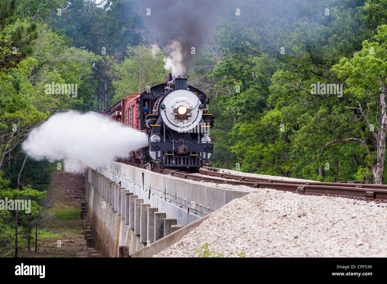 Blowdowns from 1917 Baldwin 'Pershing' 2-8-0 Consolidation steam engine locomotive 300, crossing the Neches River Bridge, near Rusk, Texas. Stock Photo