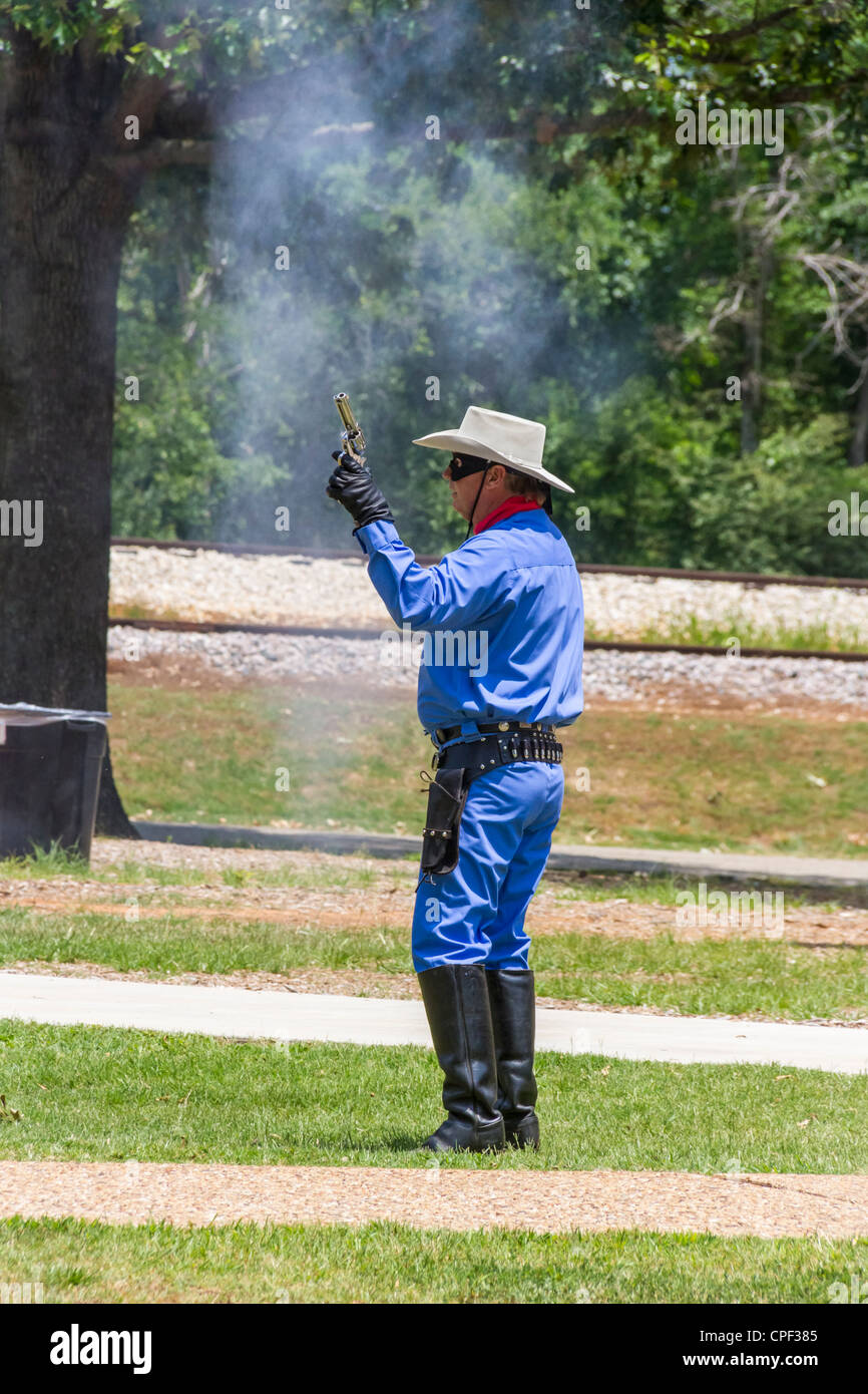 Actors posing as gunfighters staging battle with 'Lone Ranger' and Tonto to entertain tourists at 'Texas State Railroad', Palestine, Texas. Stock Photo