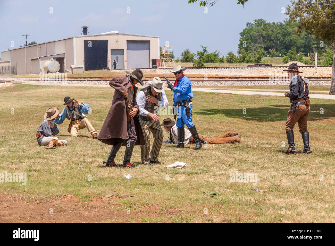 Actors posing as gunfighters staging battle with 'Lone Ranger' and Tonto to entertain tourists at 'Texas State Railroad', Palestine, Texas. Stock Photo