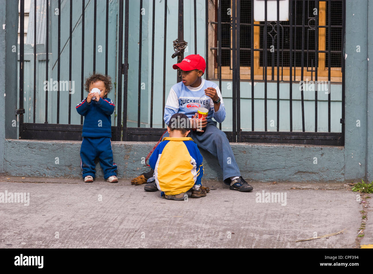 Children selling souvenirs on streets in Quito, Ecuador. Stock Photo