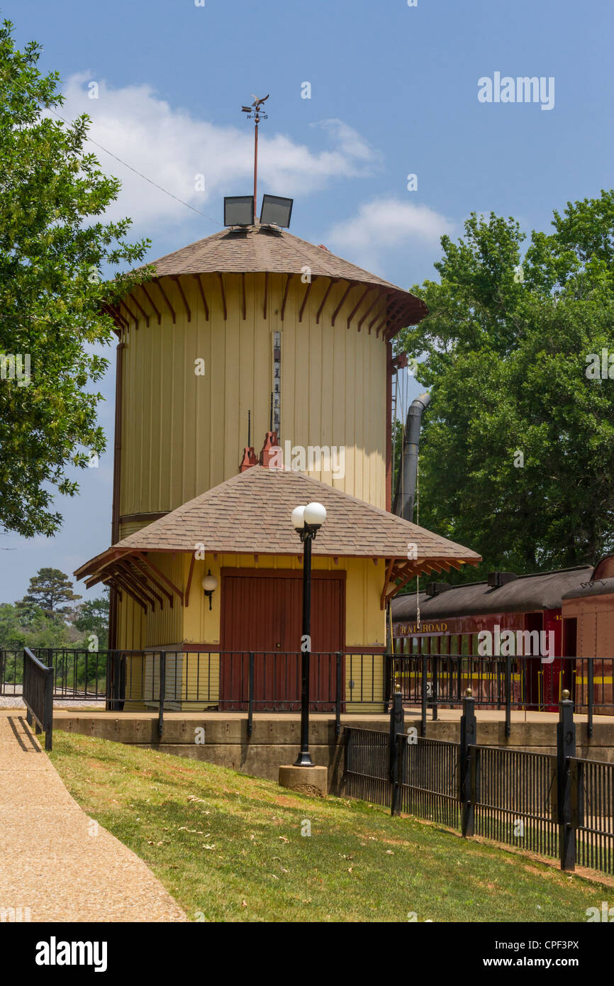 Water Tower and vintage refurbished antique rail cars at the historic Texas State Railroad Palestine Depot, Palestine, Texas. Stock Photo