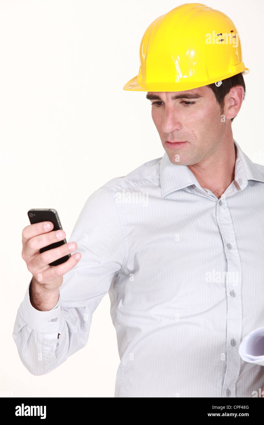 foreman reading sms Stock Photo - Alamy