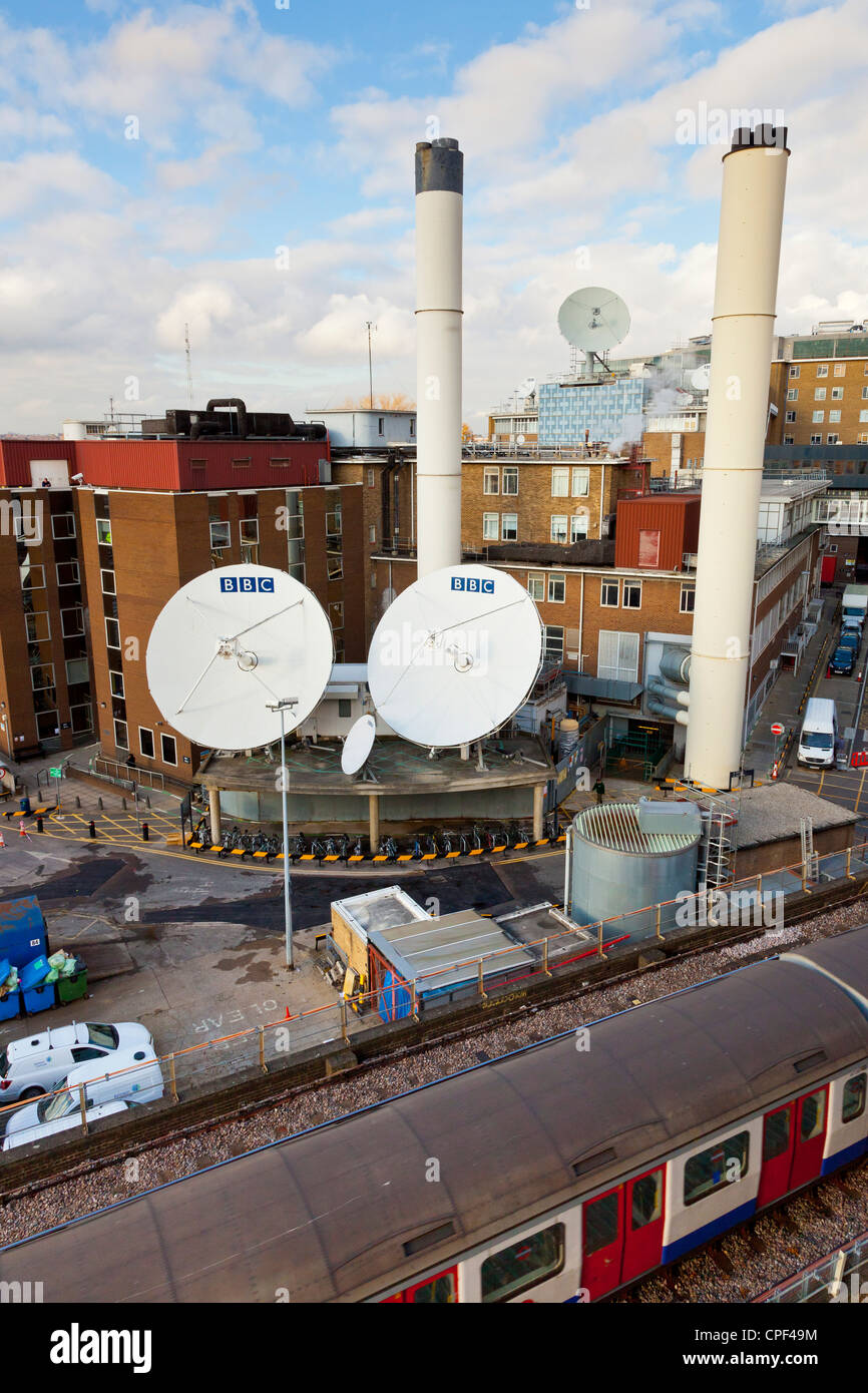 Satellite dishes and smoke stacks of power house at BBC Television Centre, Shepherds Bush, White City, London. JMH6002 Stock Photo