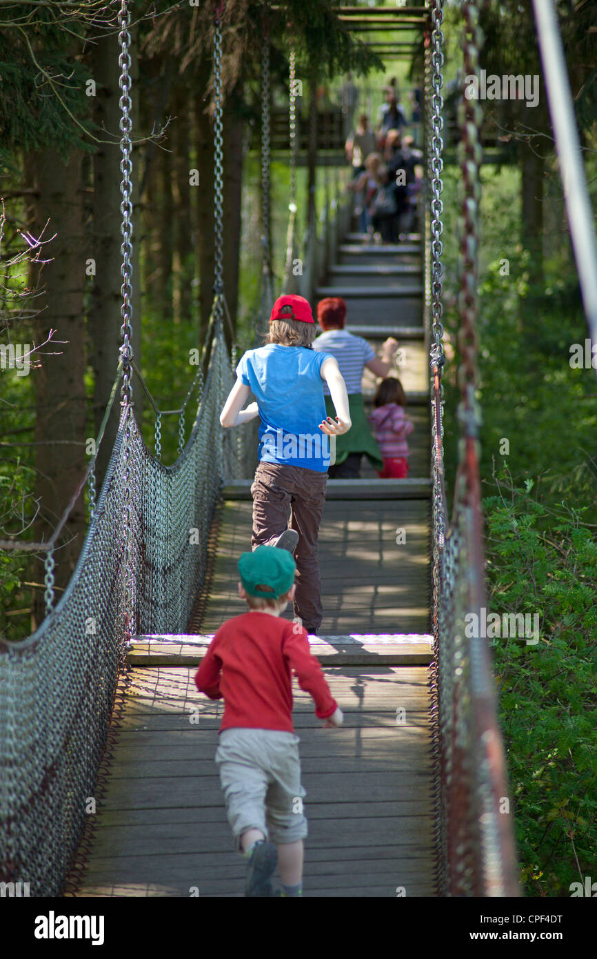 children running along a rope bridge at Serengeti Park, Hodenhagen ...