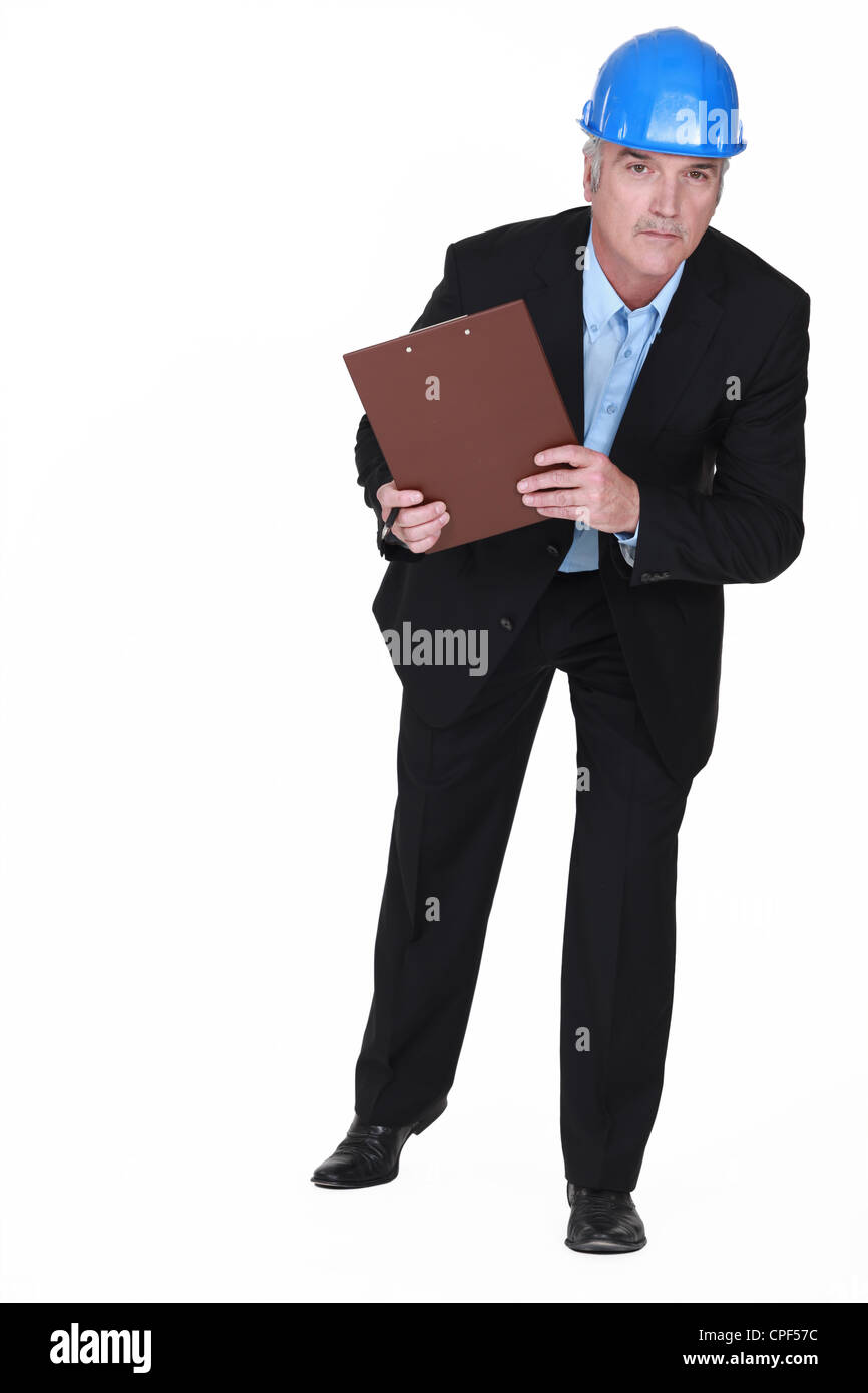 mature foreman holding clipboard Stock Photo - Alamy