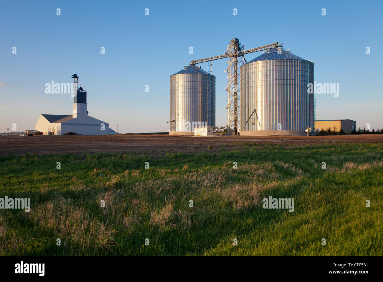 Fertilizer barn, hay bales, farmland, Winner, South Dakota Stock Photo
