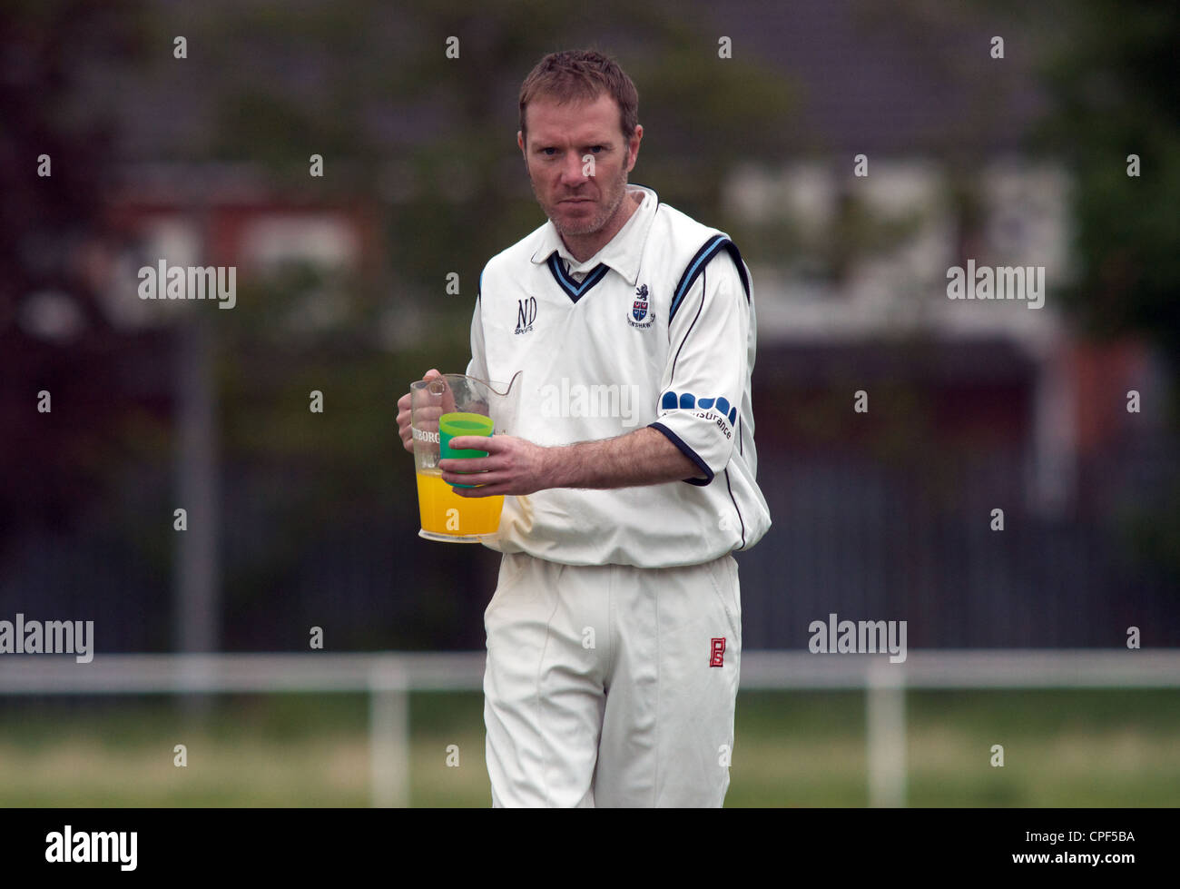 player carries soft drink at cricket match drinks break Stock Photo Alamy