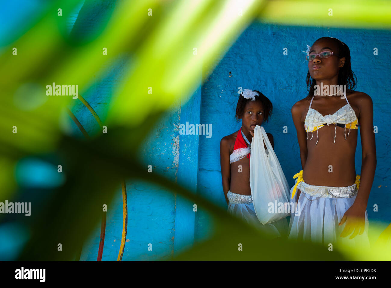 Young Brazilian girls wait in front of the the temple before the procession in honor to Yemanjá in Amoreiras, Bahia, Brazil. Stock Photo