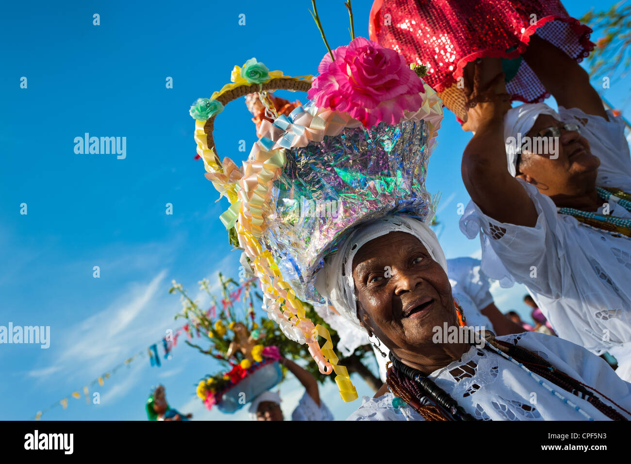 Baiana Women Carry Religious Figurines During The Ritual Procession In Baiana Women Carry Religious Figurines During The Ritual Procession In