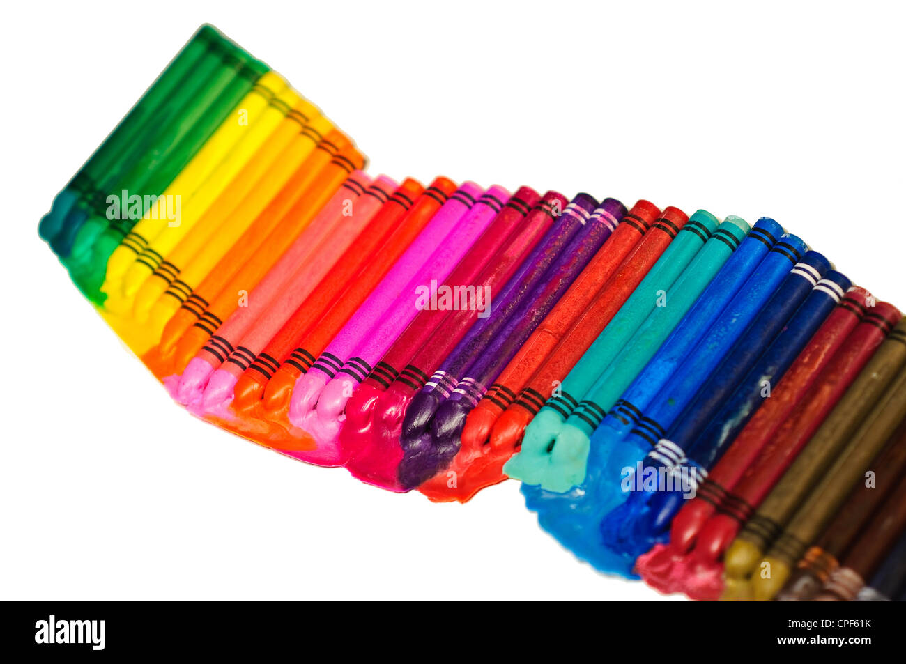 Staggered row of multicolored melting crayons, differential focus Stock ...