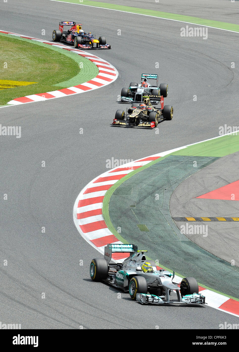four cars race through curve during the Formula 1 Grand Prix of Spain ...