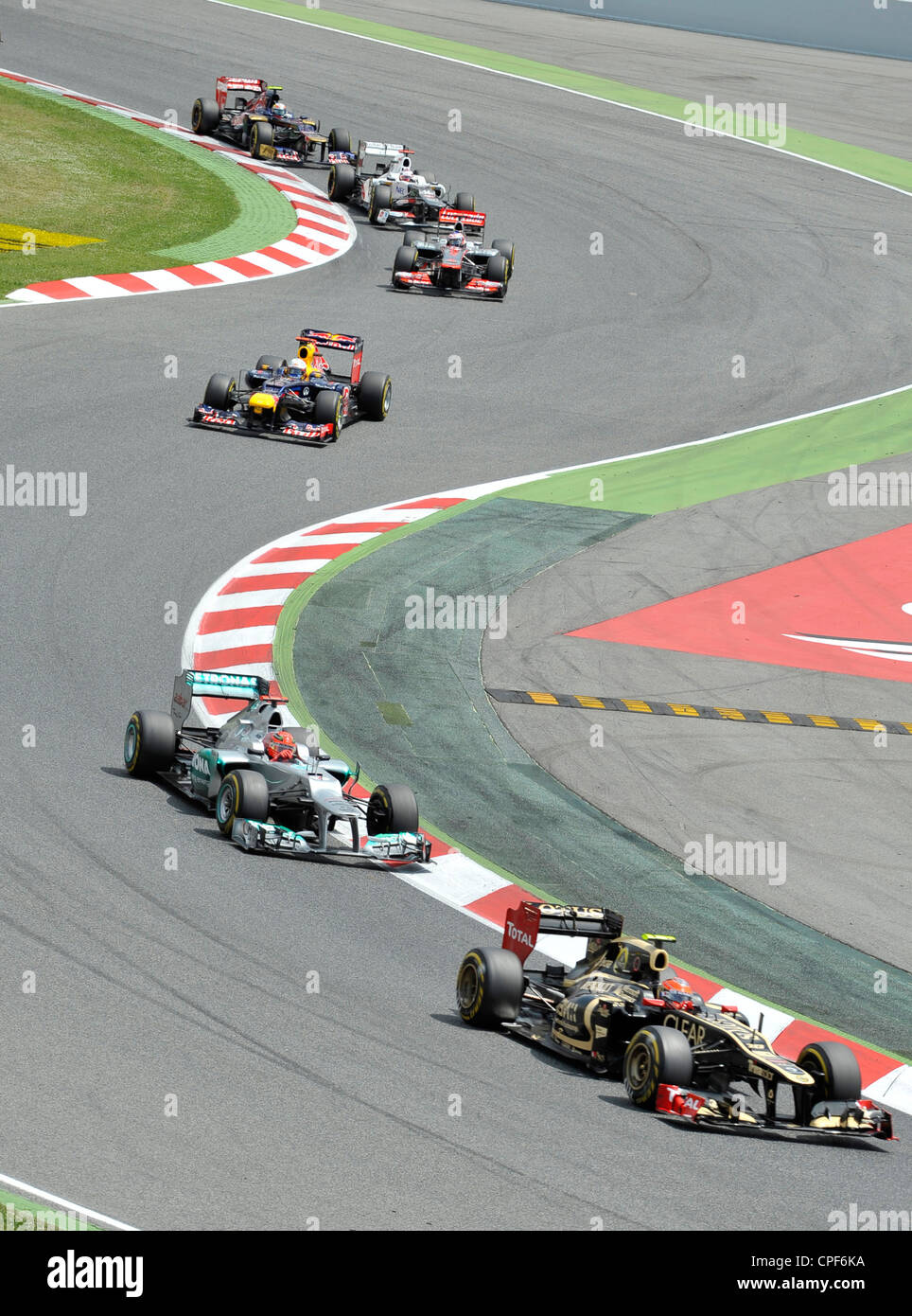 six cars race through curve during the Formula 1 Grand Prix of Spain ...
