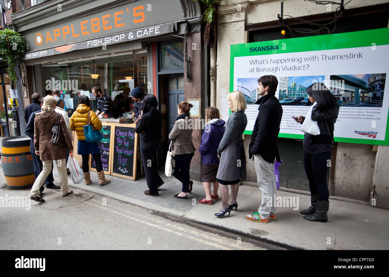 Queue of people outside Applebee's fish shop & cafe, Stoney Street, London, SE1, England, UK Stock Photo