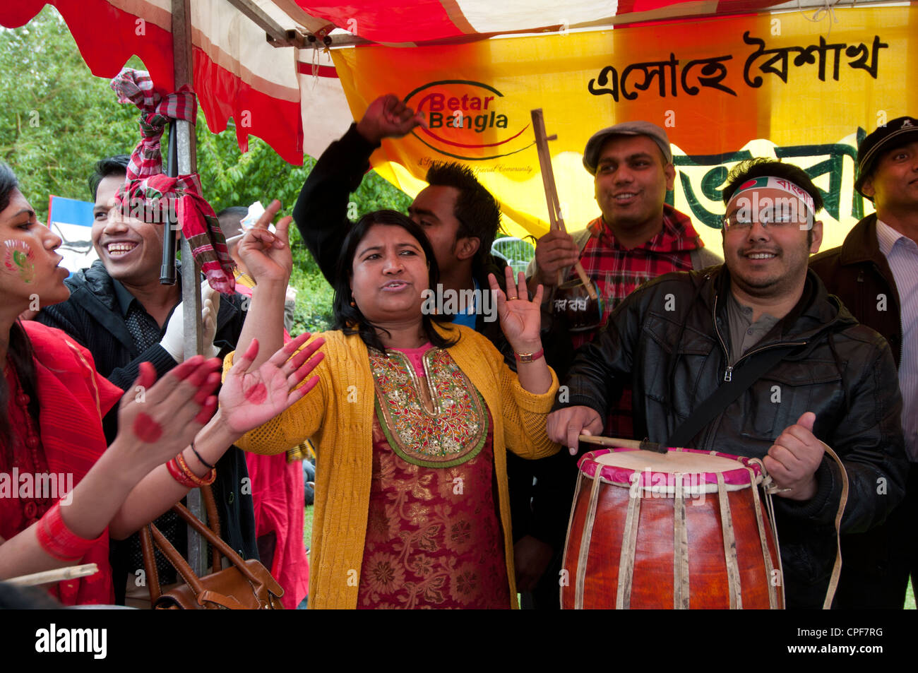 Boishakhi Mela, celebration for Bangladesh New Year. Betar Bangla radio  station has live music on its stall Stock Photo - Alamy