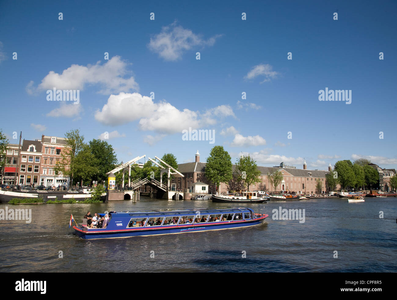 Netherlands. Amsterdam. Tourist boat on river Amstel. Stock Photo