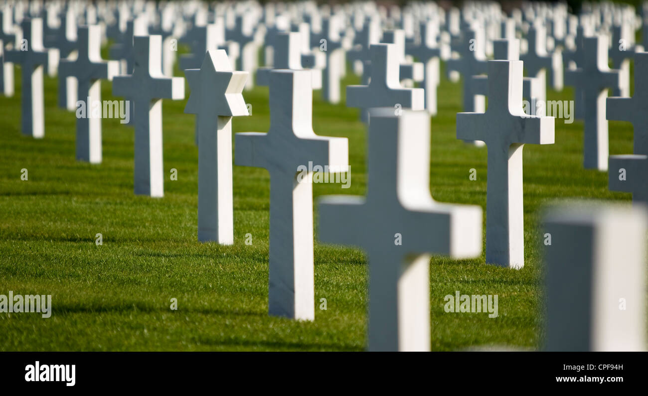 Rows of white war grave headstones focusing on one Star of David grave to the left of the photo. Stock Photo