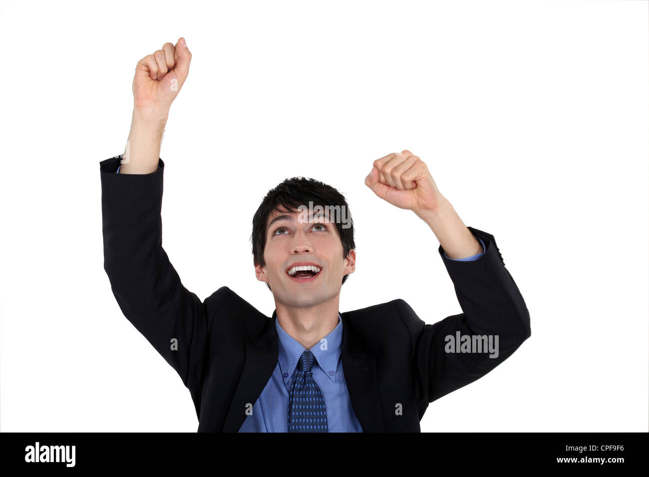 Excited businessman raising his arms in the air Stock Photo - Alamy