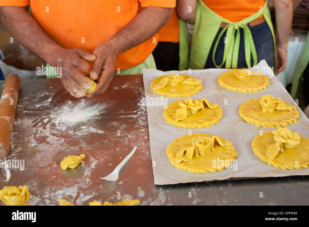 Man in a bakery preparing dough ready to be made into tarts Stock Photo