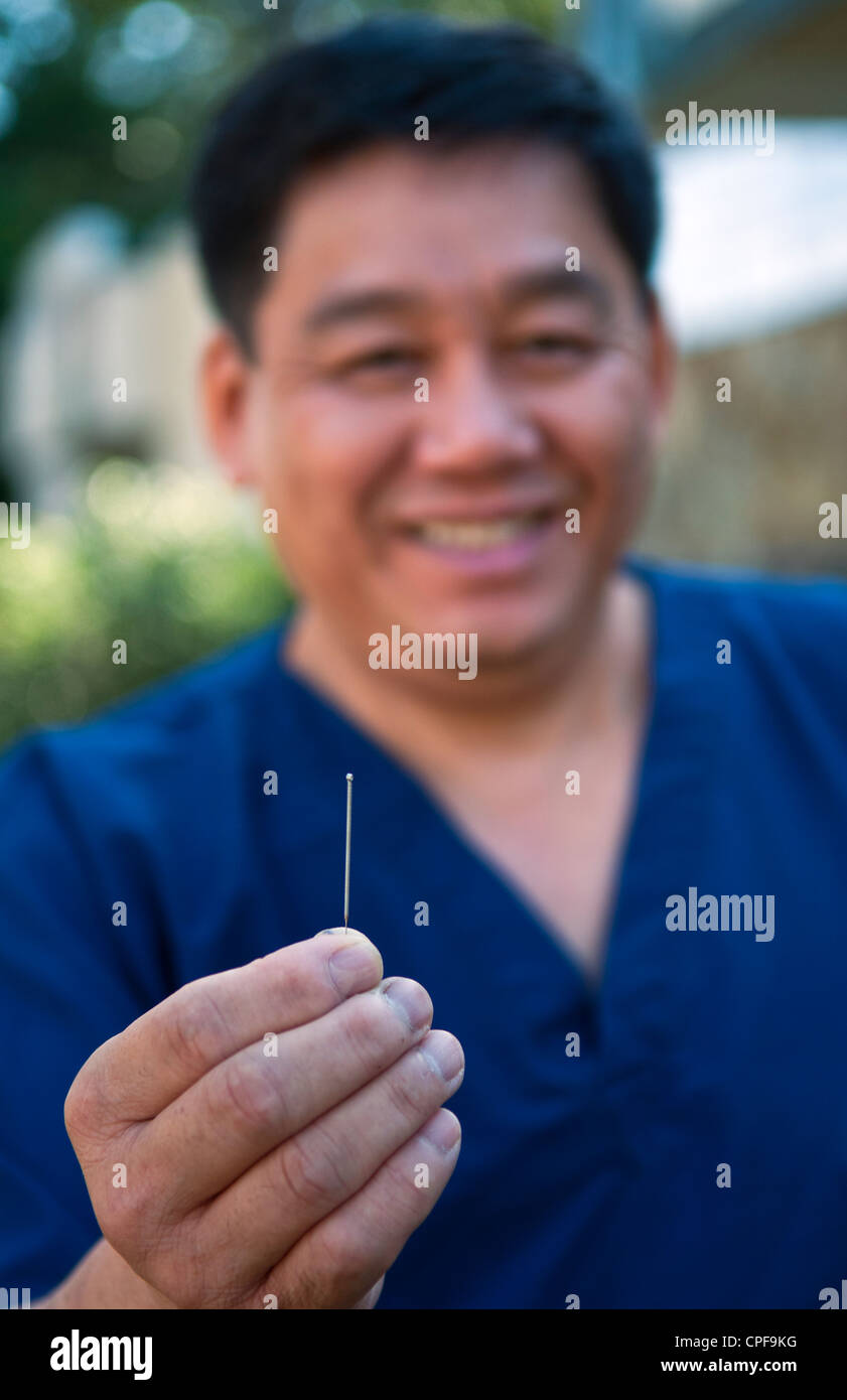 Chinese Acupuncture pain control doctor with single needle portrait