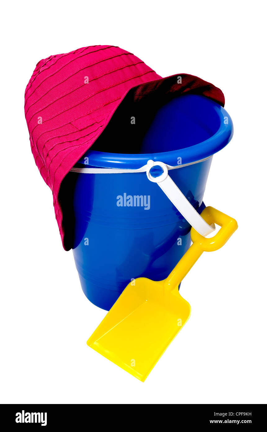 Beach toys isolated on white background with clipping path. Sand pail, shovel, and beach hat. Stock Photo