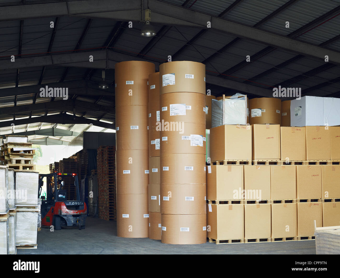 Stacked palettes and cardboard containers at a printing press in ...