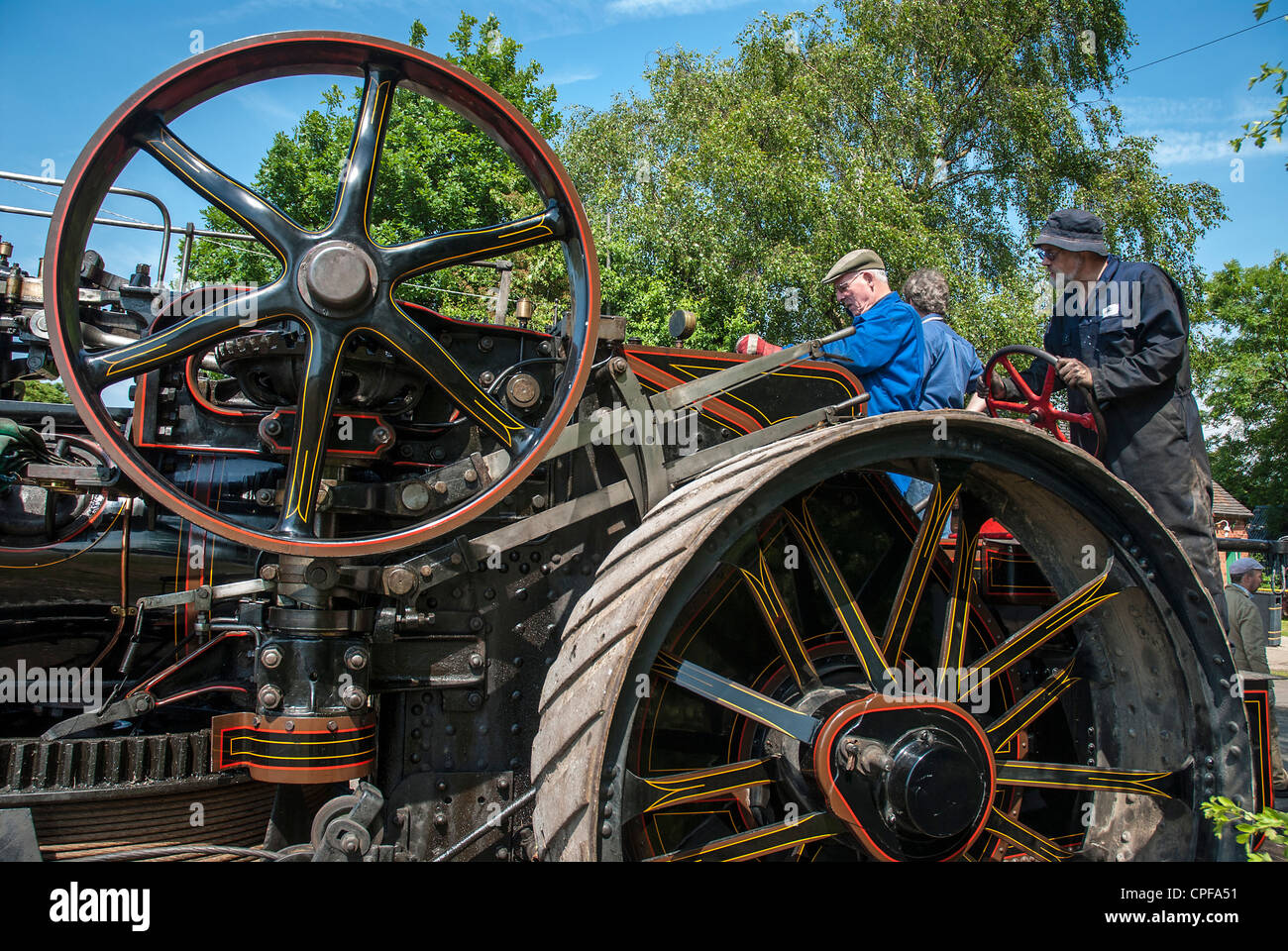 Driver and engine man driving huge steam engine Stock Photo - Alamy