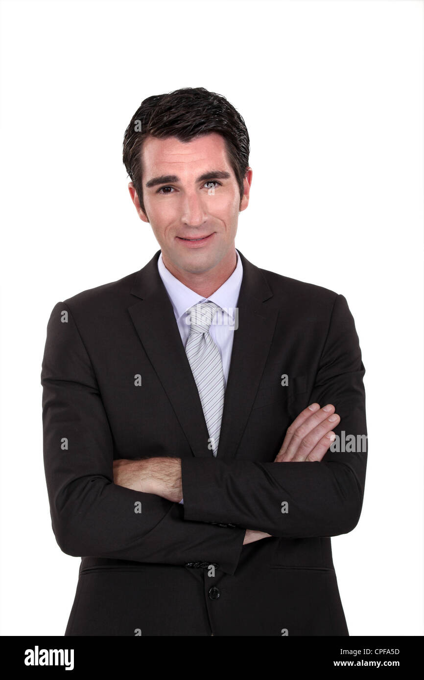 Portrait of a businessman with his arms crossed Stock Photo - Alamy