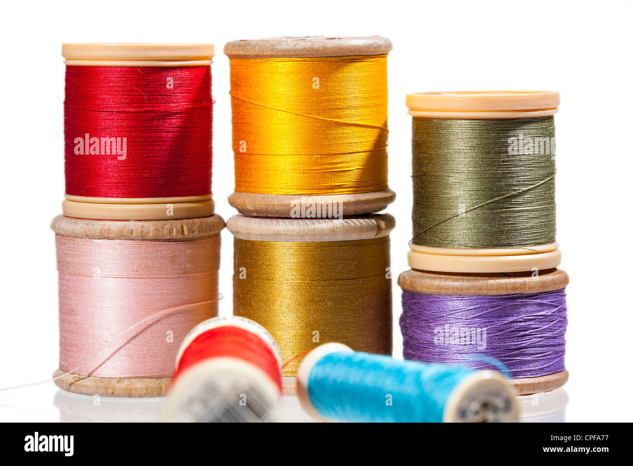Sewing threads on bobbins in different colours Stock Photo Alamy