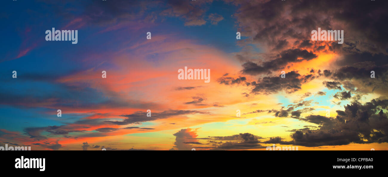 Panorama of the cloudy sky at sunset time Stock Photo - Alamy