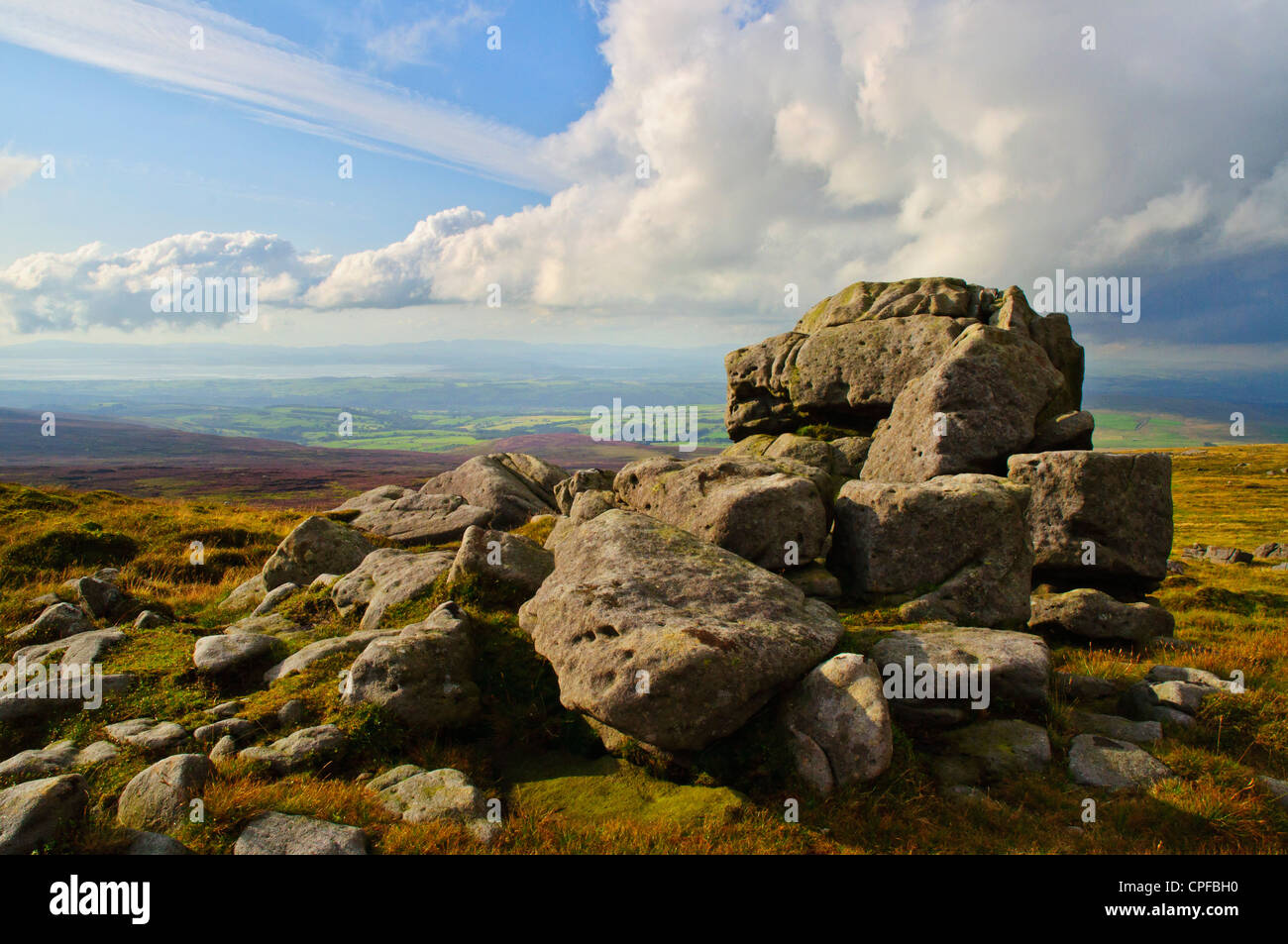 Rocks at the west top of Ward’s Stone in the Forest of Bowland Lancashire England, looking to Morecambe Bay & the Lake District Stock Photo