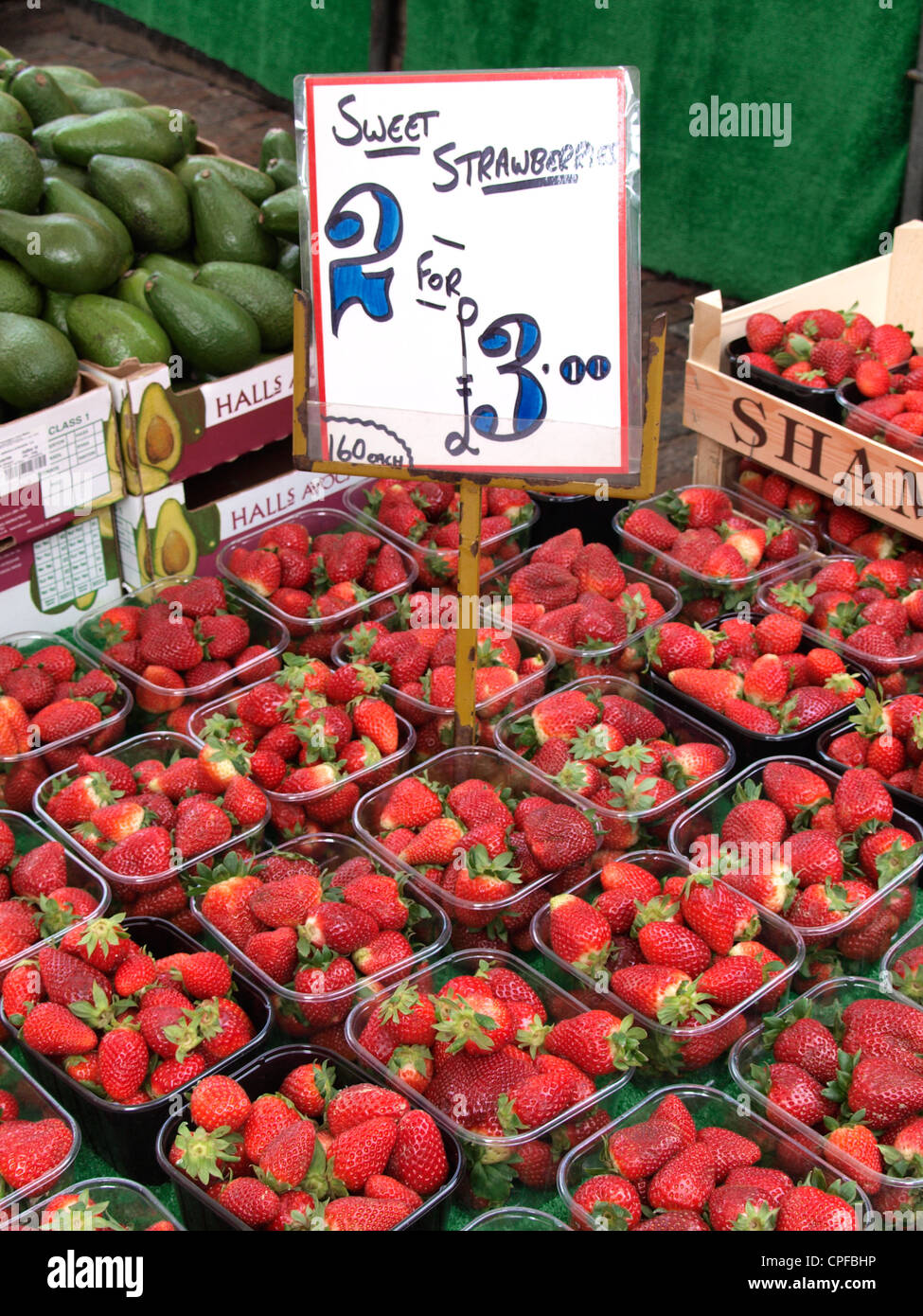 Strawberries for sale on a fruit and veg market stall, Cambridge, UK Stock Photo